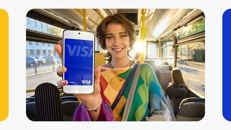 Woman paying by phone on a bus